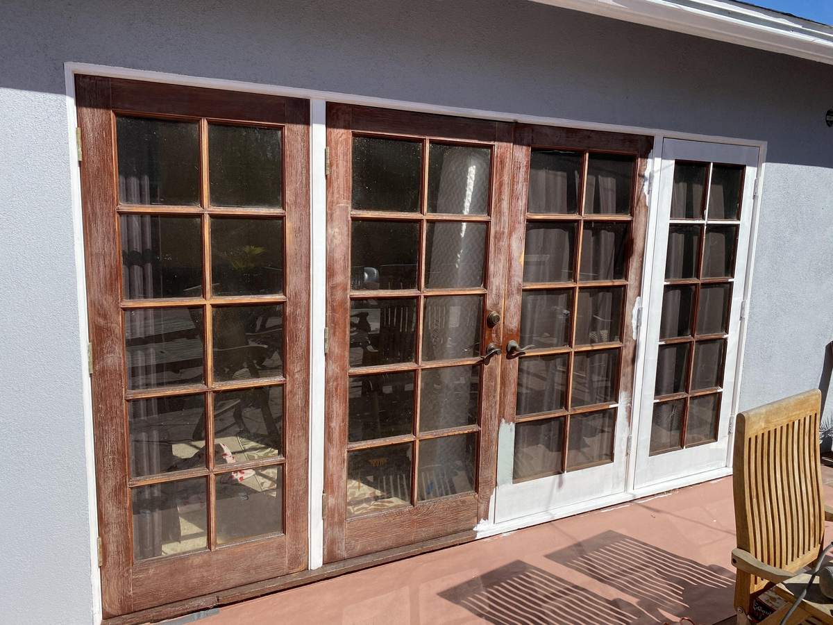 Freshly stained wood French doors, painted by Rolling Painting Co.