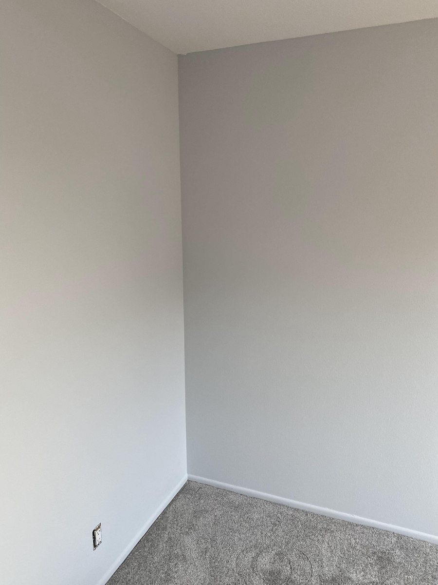 Freshly painted room corner, finished by Rolling Painting Co.